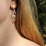 Hanging leaf earrings in gold and silver