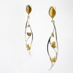 Hanging leaf earrings in gold and silver