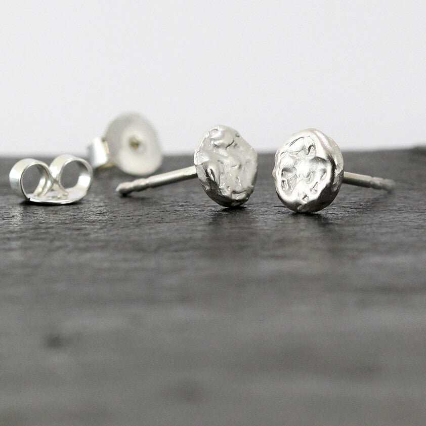 Melted Silver Studs: Melted, abstract and unique.