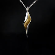 Silver and Gold Pendant: A gold and silver sculpture that you can wear