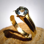 Engagement Ring: 14k Gold/ Aquamarine. Gold with a touch of sky Blue..