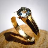 Engagement Ring: 14k Gold/ Aquamarine. Gold with a touch of sky Blue..