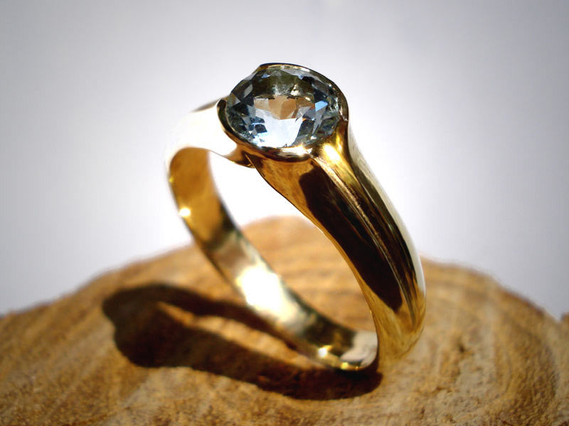 Engagement Ring: 14k Gold/ Aquamarine. Gold with a touch of sky Blue..
