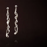 Silver Earrings: Long, Elegant and unique. They have a story to tell..