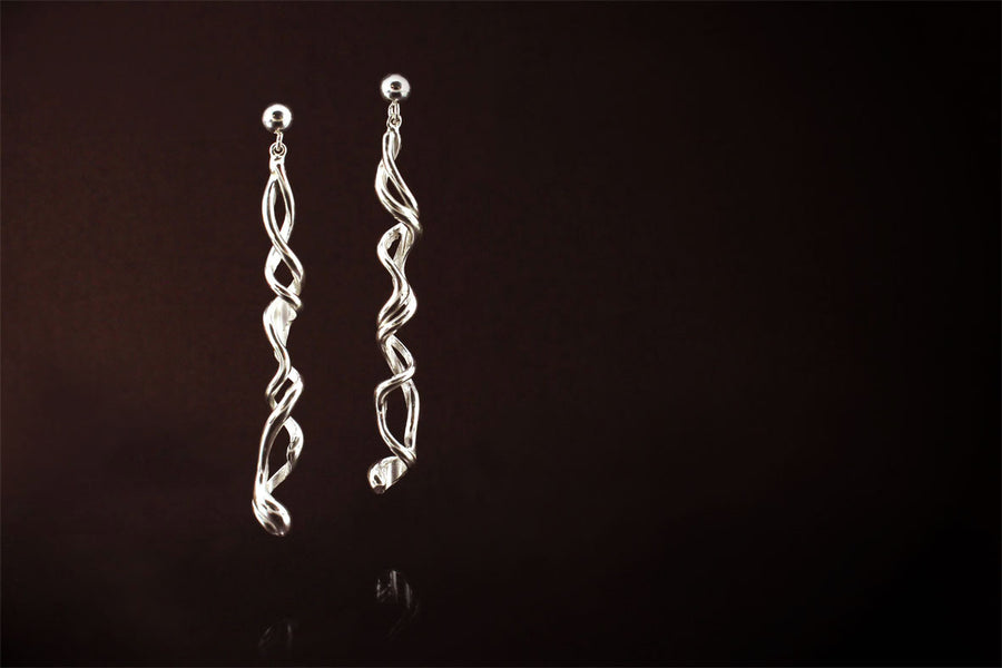 Silver Earrings: Long, Elegant and unique. They have a story to tell..