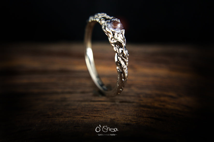 Engagement ring:  In love and melted together. This one is perfect...